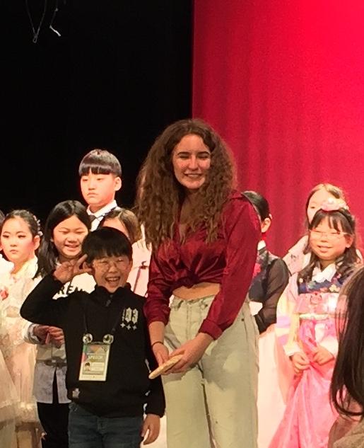 VAAS student taking a photo with Korean Elementary student